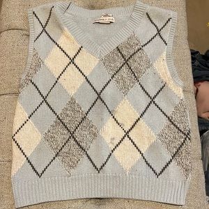 This is a blue little sweater with lil stripes and all that good good